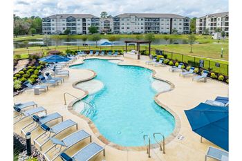 Resort-inspired swimming pool with tanning deck